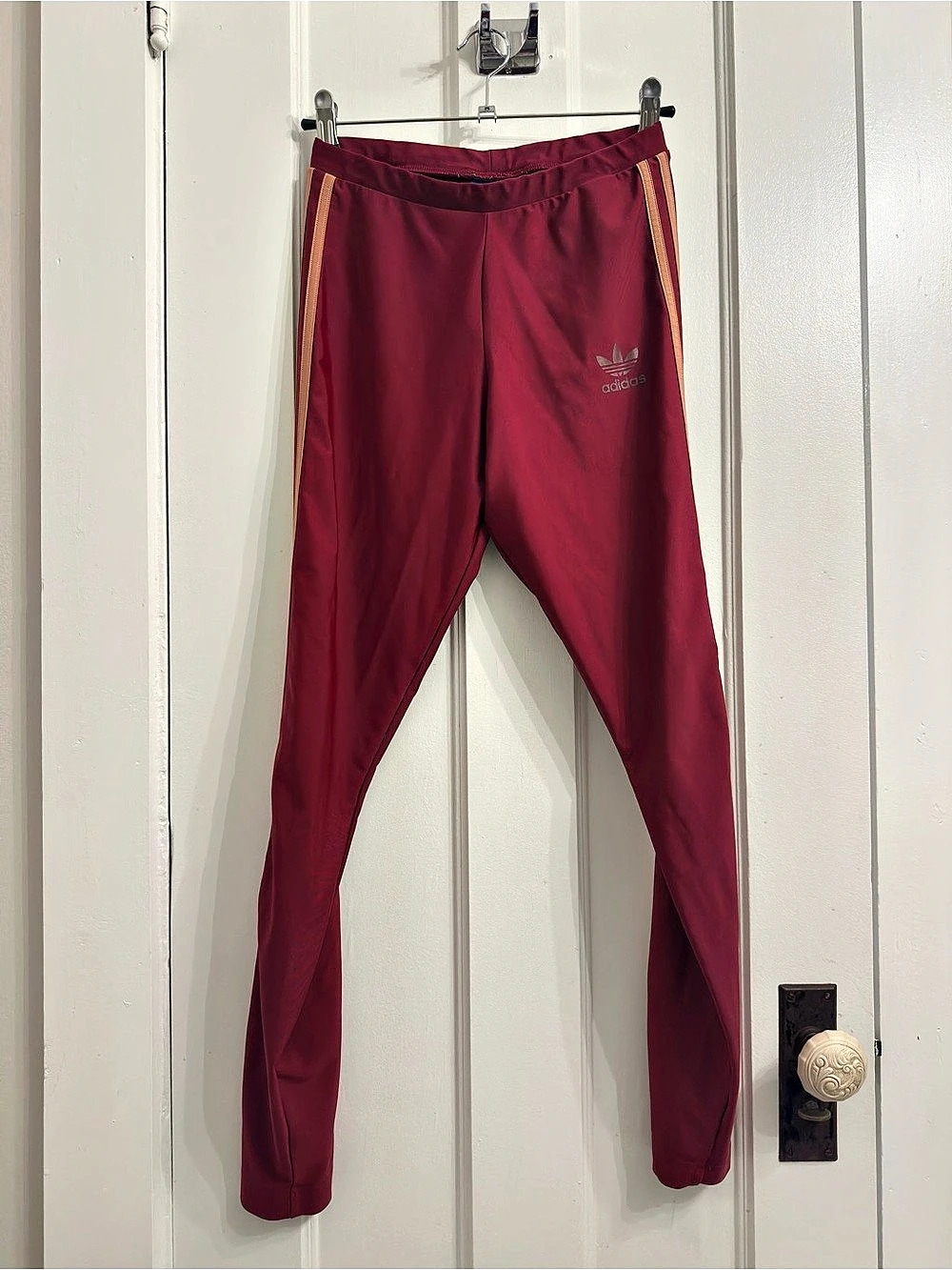 Adidas burgundy joggers with pink stripes